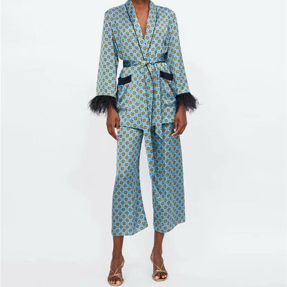 Vintage feather sleeve kimono set in blue geometric print with belted jacket featuring feather cuffs and cropped wide leg pants
