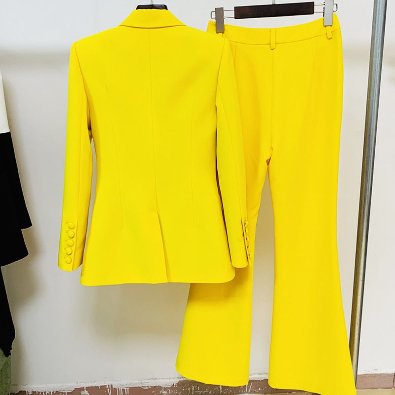 Bright yellow tailored flare pants blazer set for women hanging on hangers showing back of blazer and flared trousers