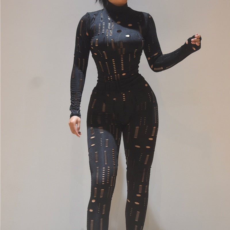 Black fitted hollow out long sleeve turtleneck outfit jumpsuit with geometric cutouts and full length pants
