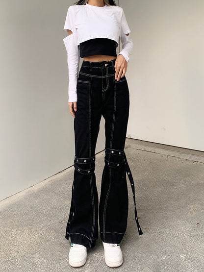 Model wearing EtherealBe black baggy cargo jeans for women high waist flared leg with knee straps and contrast stitching
