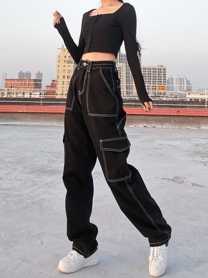 Model wearing EtherealBe black baggy cargo jeans for women with contrast stitching and cargo pockets
