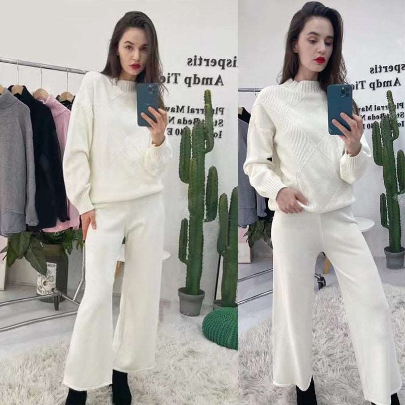 Model wearing cream knit sweater with matching wide leg pants in boutique mirror showing chic wide leg sweater pants set