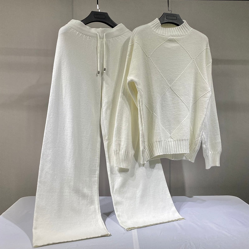 Cream knit diamond sweater with matching drawstring pants on hangers chic wide leg sweater pants set for cozy wear
